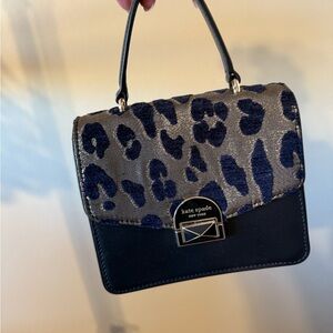 Kate Spade black and metallic leopard print shoulder bag with clasp